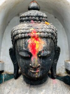 Image of head of Buddha statue to symbolize this Dharma Thought on True Freedom.